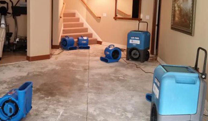 image of residential home water damage restoration by equipment